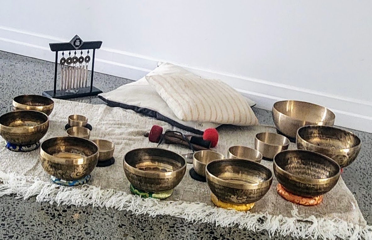 Collection of Tibetan singing bowls arranged for a session